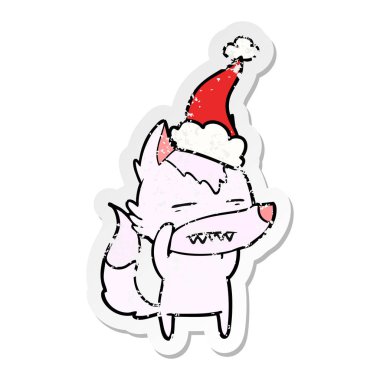 sıkıntılı etiket karikatür Noel Baba şapkası giyen diş gösterilen kurt el çekilmiş