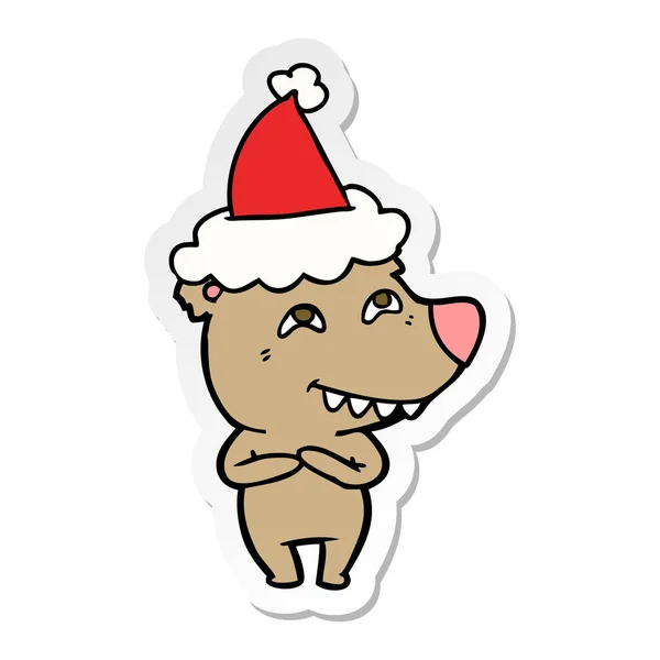 Desenho animado adesivo de um urso mostrando dentes usando chapéu de Papai Noel —  Vetores de Stock