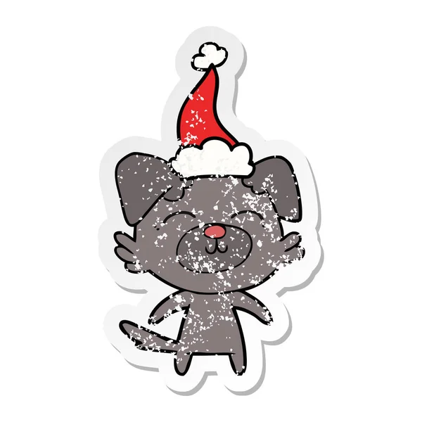 Sıkıntılı Etiket Karikatür Noel Baba Şapkası Giyen Bir Köpek Çekilmiş — Stok Vektör