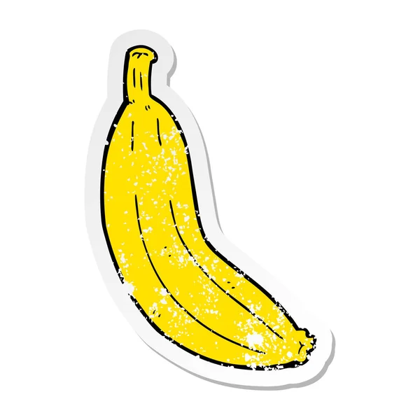 Verontruste sticker van een cartoon-banaan — Stockvector