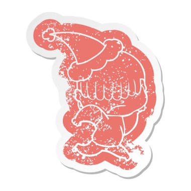 Noel Baba şapkası giyen dağınık saçlı bir çocuğun ilginç karikatür sıkıntılı etiket