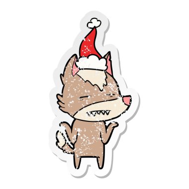 sıkıntılı etiket karikatür Noel Baba şapkası giyen diş gösterilen kurt el çekilmiş