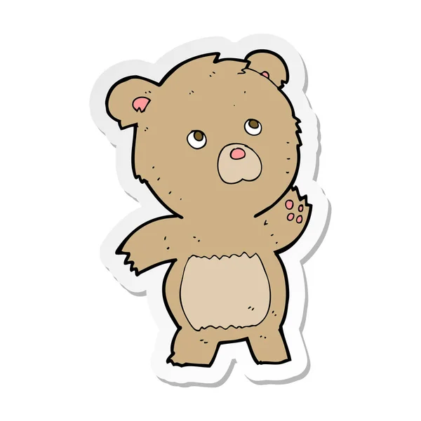 Adesivo di un cartone animato curioso orsacchiotto — Vettoriale Stock