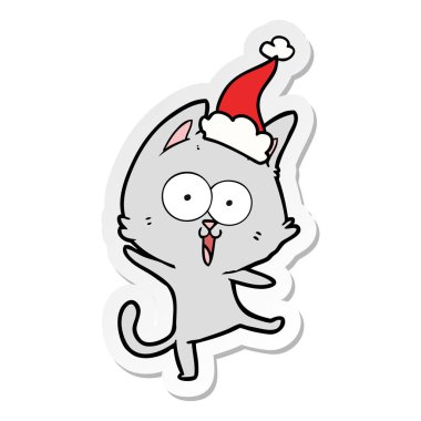 Noel Baba şapkası giyen bir kedinin komik etiket çizgi film