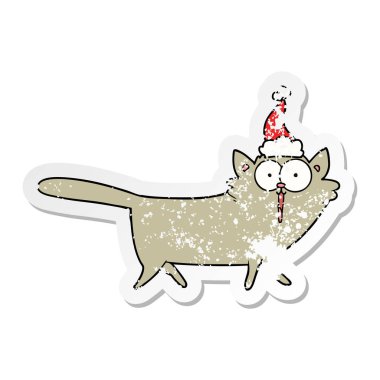 sıkıntılı etiket karikatür Noel Baba şapkası giyen bir kedi el çekilmiş