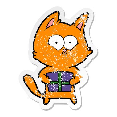 Noel hediyesi tutan bir karikatür kedi sıkıntılı etiket