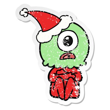 elle çizilmiş bir Tepegöz'ü yabancı uzay adamı Noel Baba şapkası giyen etiket karikatür sıkıntılı