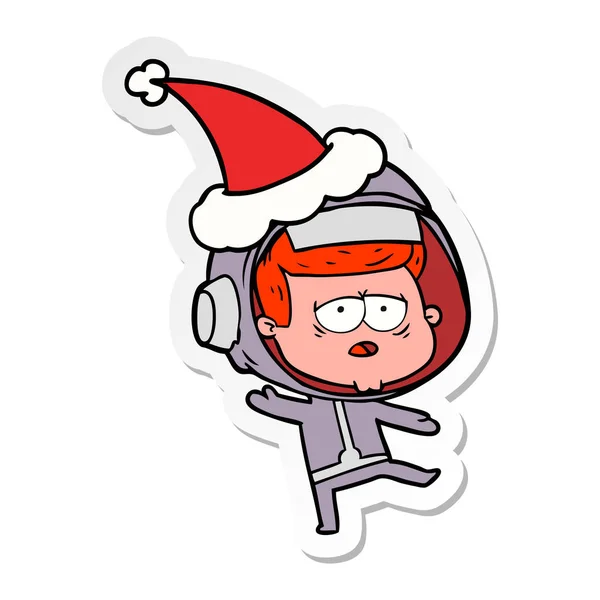 Sticker cartoon of a tired astronaut wearing santa hat — Stock Vector