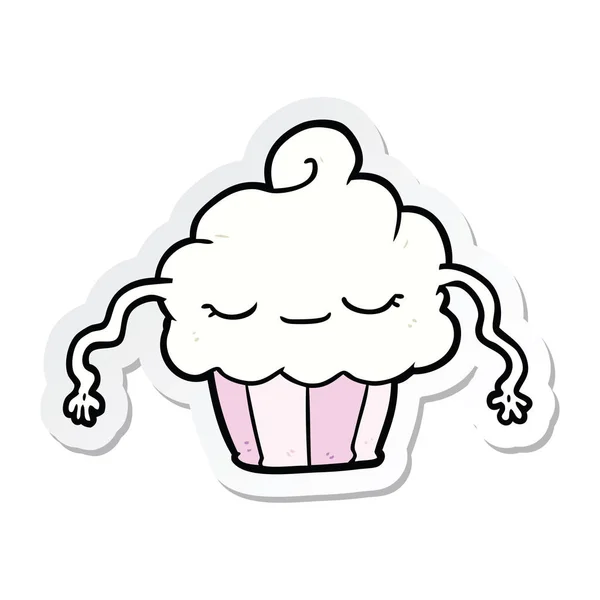 Sticker of a cartoon cupcake — Stock Vector