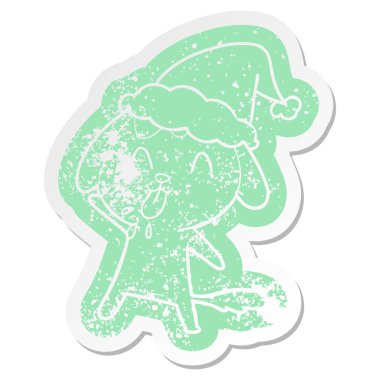 Noel Baba şapkası giyen bir köpek sevimli çizgi sıkıntılı etiket