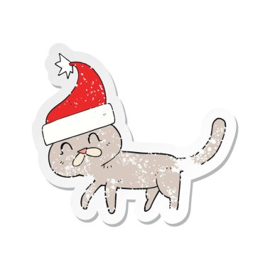 Retro etiket Noel şapka giymiş bir karikatür kedi sıkıntılı