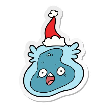 Noel Baba şapkası giyen bir mikrop etiket karikatür el çekilmiş