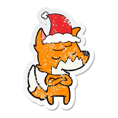 sıkıntılı etiket karikatür Noel Baba şapkası giyen bir tilkinin dostu el çekilmiş