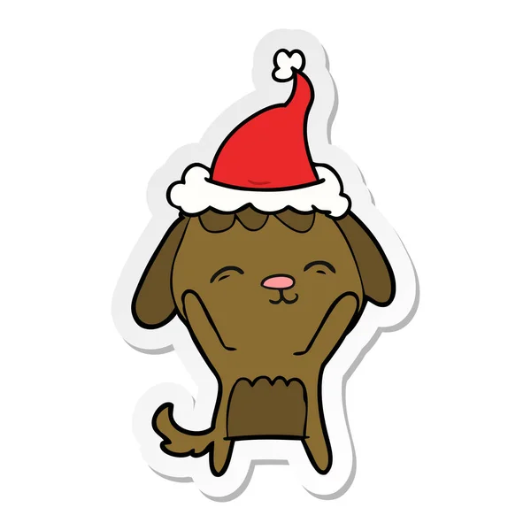 Fröhliche Sticker Karikatur eines Hundes mit Weihnachtsmütze — Stockvektor