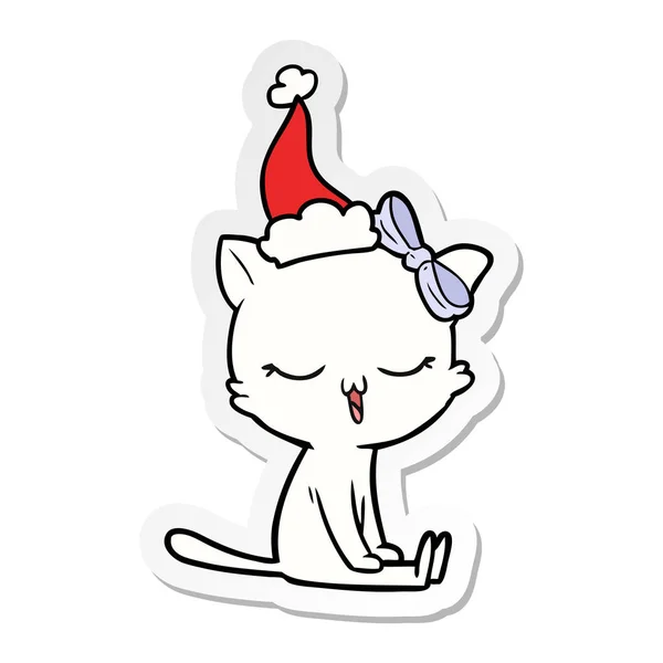手绘贴纸卡通猫与弓头戴圣诞老人帽子 — 图库矢量图片