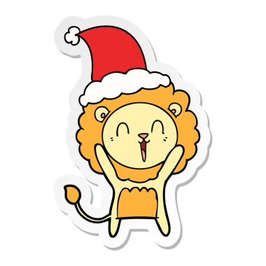 Aslan gülerek el etiket karikatür giyen Noel Baba şapkası, çekilmiş