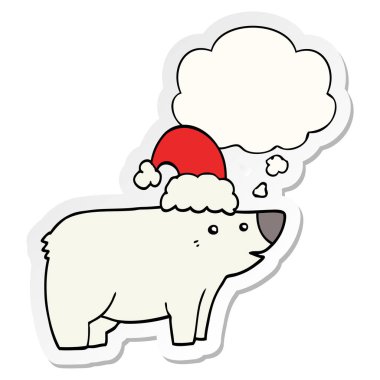 karikatür ayı noel şapkası giyen ve bir baskı olarak kabarcık düşünce