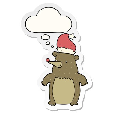 karikatür ayı noel şapkası giyen ve bir baskı olarak kabarcık düşünce