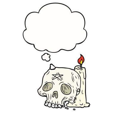 karikatür ürkütücü kafatası ve mum ve düşünce balonu