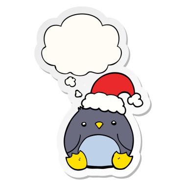 sevimli karikatür penguen noel şapka giyen ve olarak kabarcık düşünce