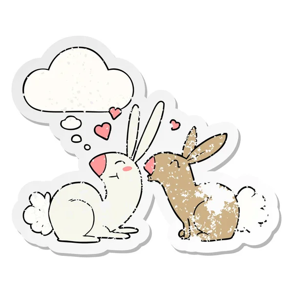 Cartoon rabbits in love and thought bubble as a distressed worn — Stock Vector