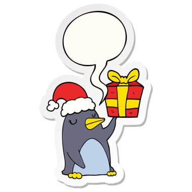 karikatür penguen ve noel hediye ve konuşma kabarcık etiket