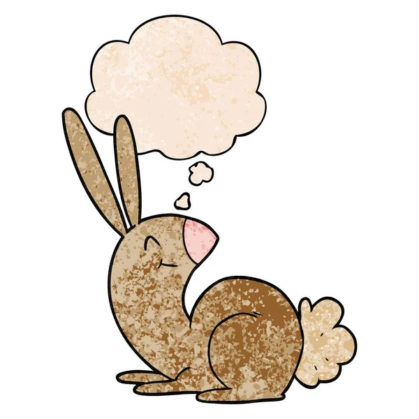 Niedliches Cartoon-Kaninchen und Gedankenblase im Grunge-Muster — Stockvektor