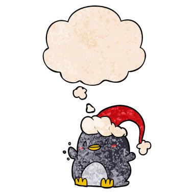 karikatür penguen noel şapka ve grun düşünce balonu giyen