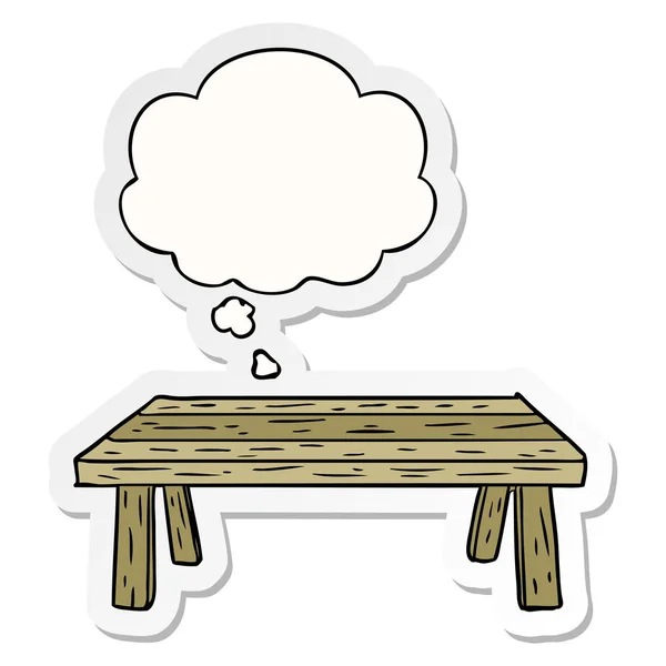 Cartoon table and thought bubble as a printed sticker — Stock Vector
