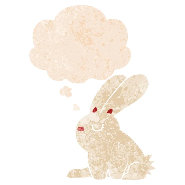 Tecknad kanin och tankebubbla i retro texturerat stil — Stock vektor