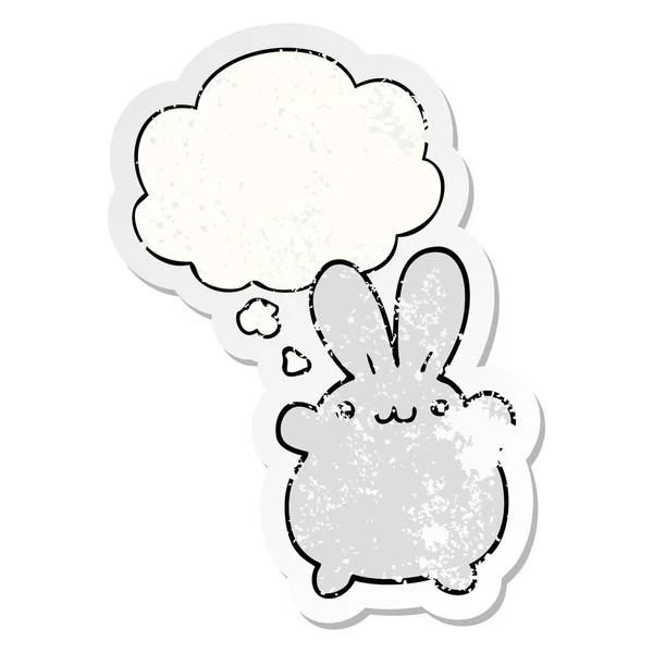 Karikatur-Kaninchen und Gedankenblase als verschlissener Aufkleber — Stockvektor