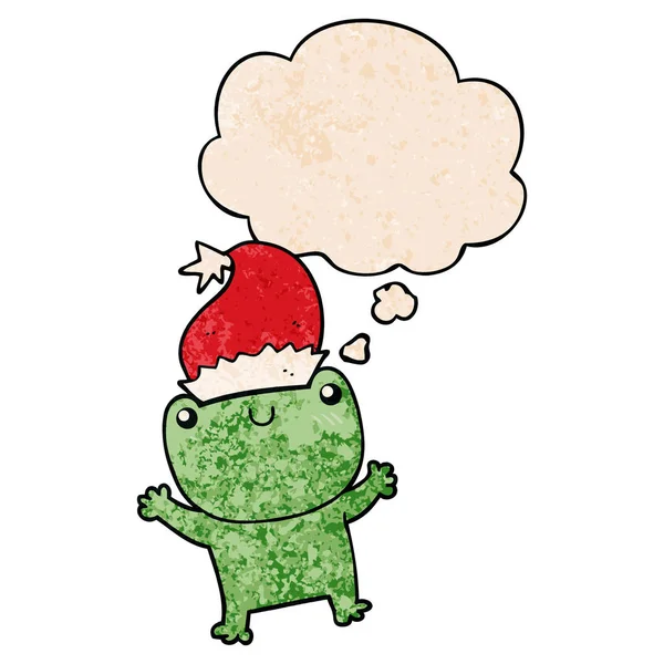 Söt tecknad groda bär jul hatt och tankebubbla i gr — Stock vektor