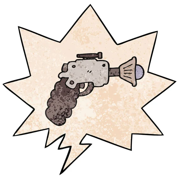 Pistola de rayos de dibujos animados y burbuja de habla en estilo de textura retro — Vector de stock