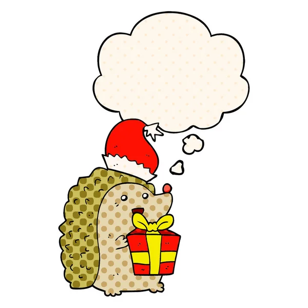 Cartoon hedgehog wearing christmas hat and thought bubble in com — Stock Vector