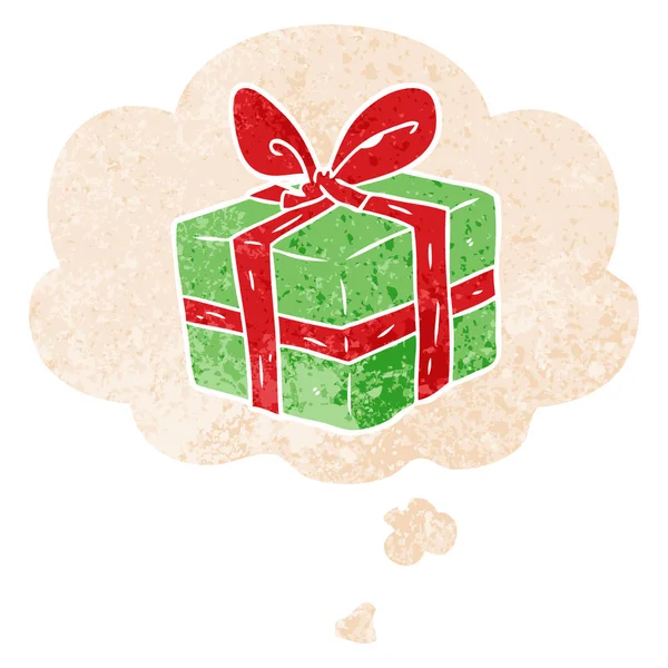 Cartoon wrapped gift and thought bubble in retro textured style — Stock Vector