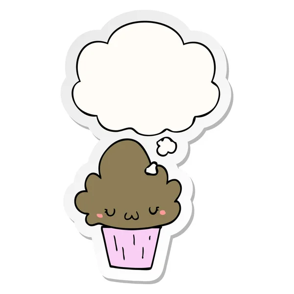 Cupcake de dibujos animados con la cara y la burbuja de pensamiento como una pegatina impresa — Archivo Imágenes Vectoriales