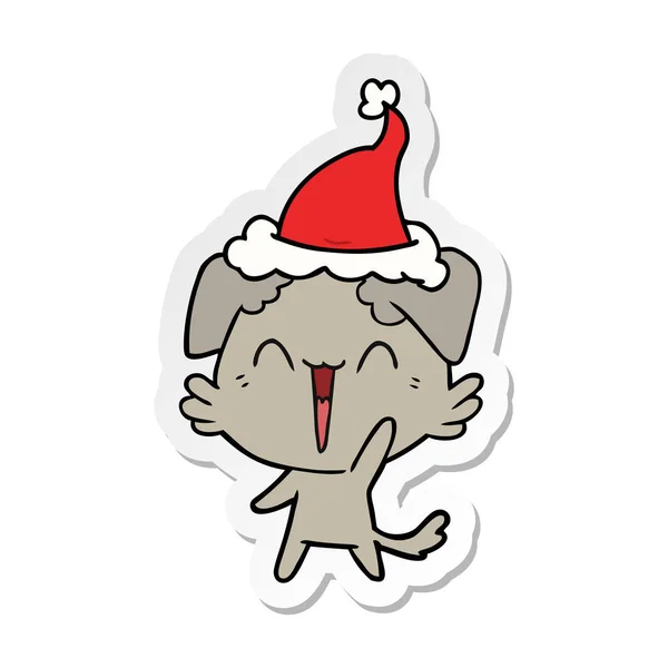 착용 산타 모자의 행복 작은 개 스티커 만화 — 스톡 벡터