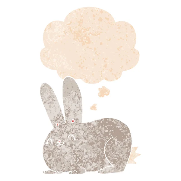 Dessin animé lapin et bulle de pensée dans un style texturé rétro — Image vectorielle