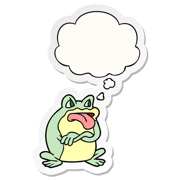 Grumpy cartoon frog and thought bubble as a printed sticker — Stock Vector