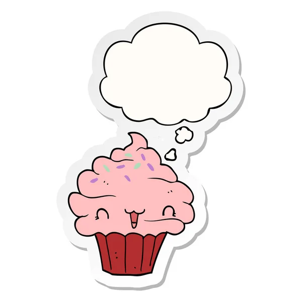 Cute cartoon frosted cupcake and thought bubble as a printed sti — Stock Vector