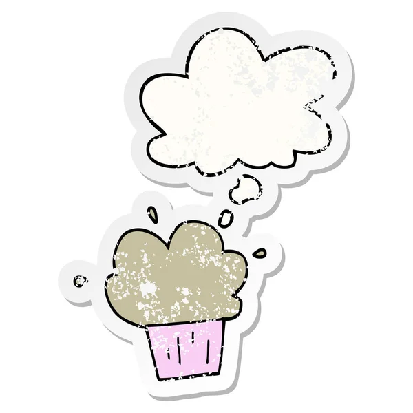 Cartoon cupcake and thought bubble as a distressed worn sticker — Stock Vector