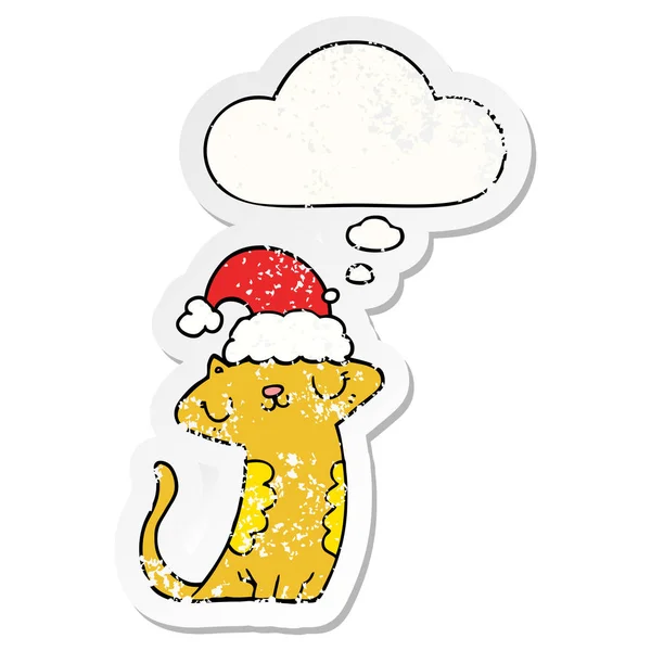 Mignon chat dessin animé portant chapeau de Noël et bulle de pensée comme un d — Image vectorielle