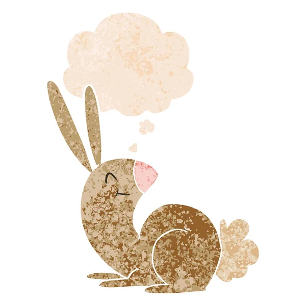 Cute cartoon rabbit and thought bubble in retro textured style — Stock Vector