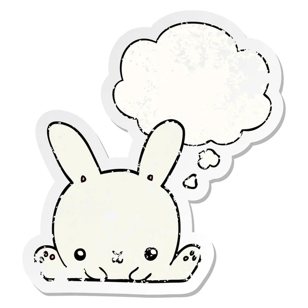 Cartoon rabbit and thought bubble as a distressed worn sticker — Stock Vector