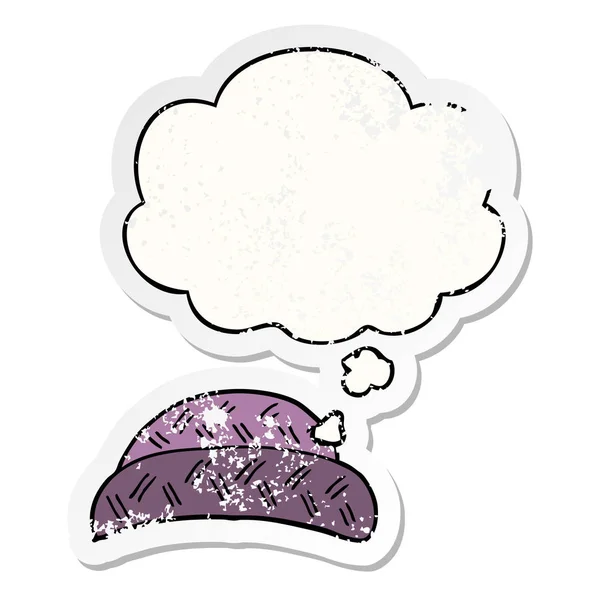 Cartoon hat and thought bubble as a distressed worn sticker — Stock Vector