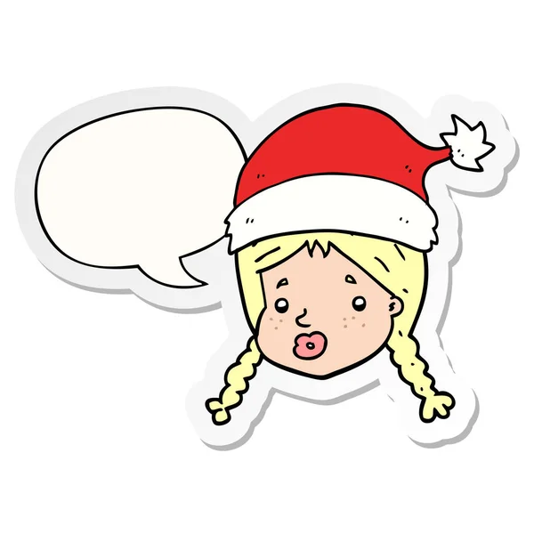 Fille de dessin animé portant chapeau de Noël et autocollant bulle de parole — Image vectorielle