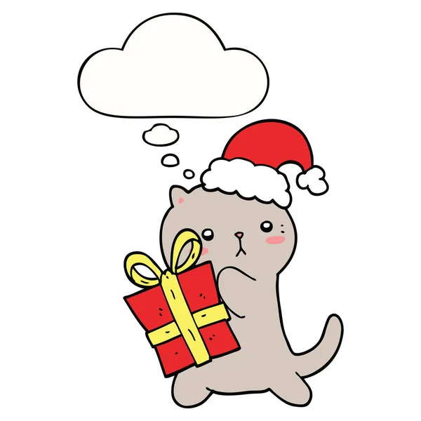 Lindo gato de dibujos animados llevando regalo de Navidad y burbuja de pensamiento — Vector de stock
