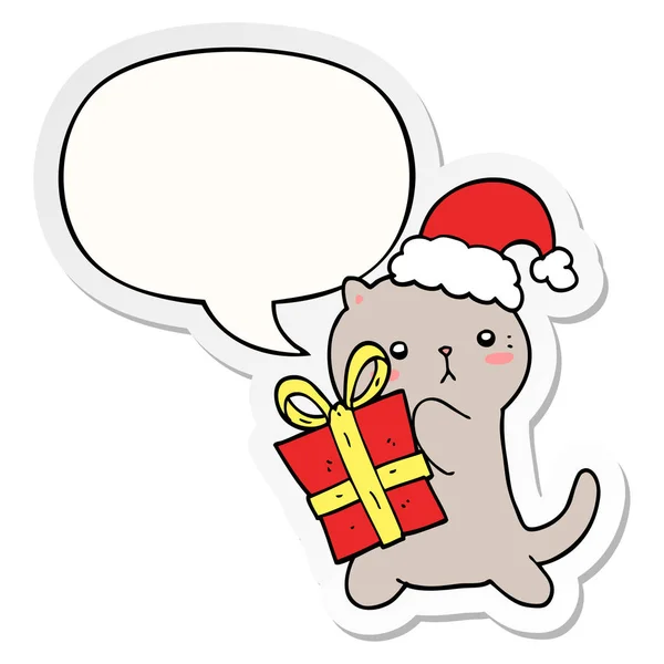 Cute cartoon cat carrying christmas present and speech bubble st — Stock Vector