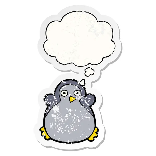 Cartoon penguin and thought bubble as a distressed worn sticker — Stock Vector