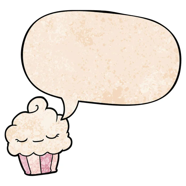 Divertido cupcake de dibujos animados y burbuja del habla en estilo de textura retro — Vector de stock